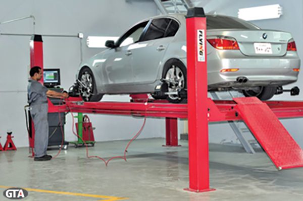 Wheel alignment service on a BMW 5 Series
