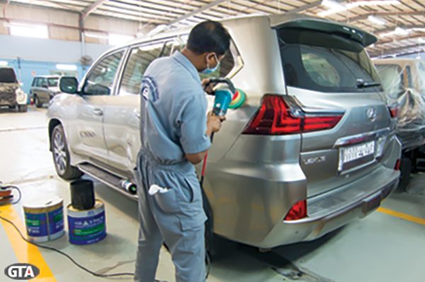 Bare-metal bodywork prep on a Lexus LX